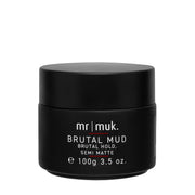 A black jar of Mr. Muk Brutal Mud Semi-Matte hair product, shown against a plain white background.