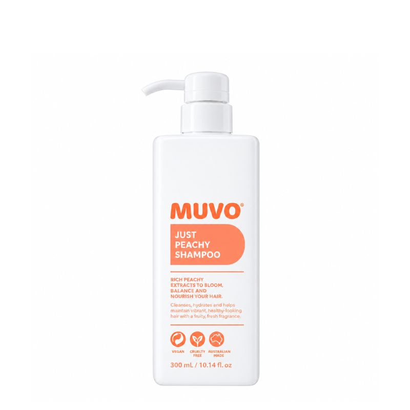A 300 mL bottle of MUVO Just Peachy Shampoo on a solid white background. The bottle is white with a white pump dispenser and features a label with orange text and a peach-colored graphic.