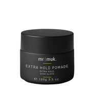 A black jar of Mr. Muk Extra Hold Pomade with white text and small yellow accent lines on a plain white background.