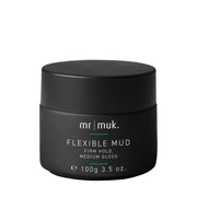 A black cosmetic jar of Mr. Muk Flexible Mud with medium gloss, featuring white text and a small teal accent line on a plain white background.