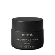 A black jar of Mr. Muk Grooming Cream with white text and a small green accent line, shown on a plain white background.